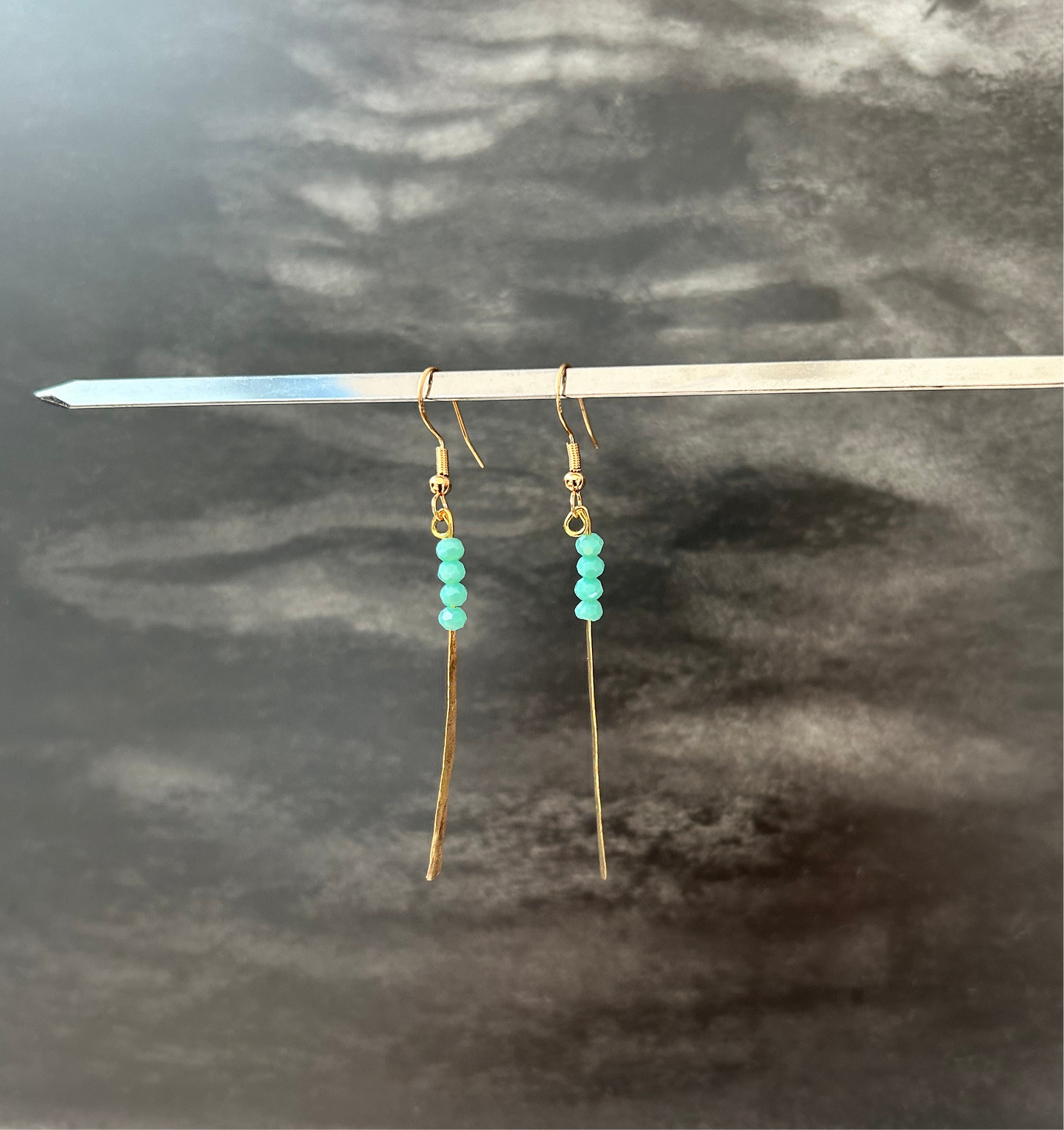 Gold plated and semi precious stones ribbon earring