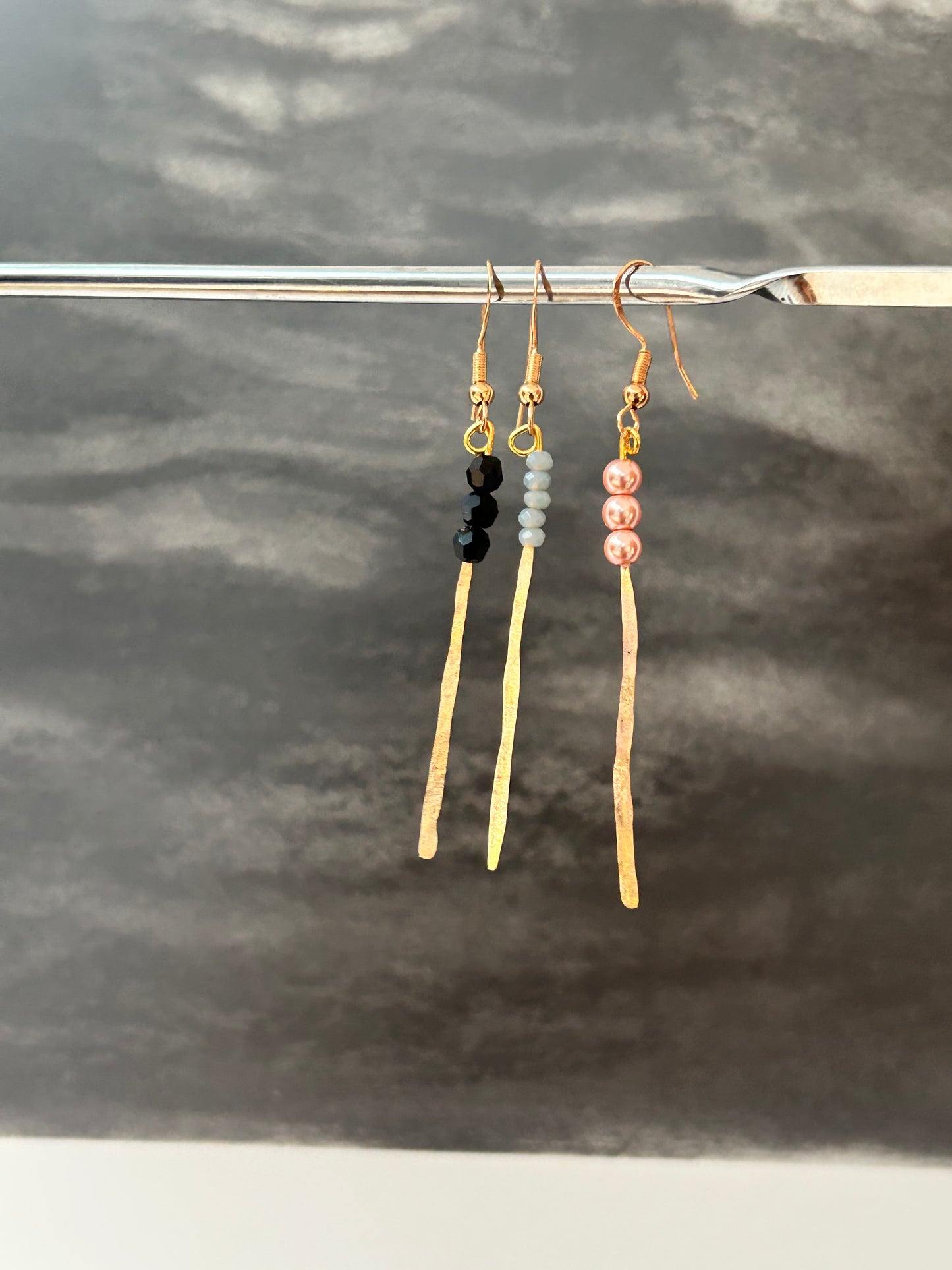 Gold plated and semi precious stones ribbon earring