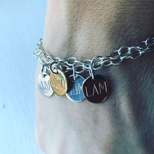 rose gold, yellow gold and silver quadruple initial disc bracelet