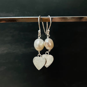 White pearl earrings with silver heart drop