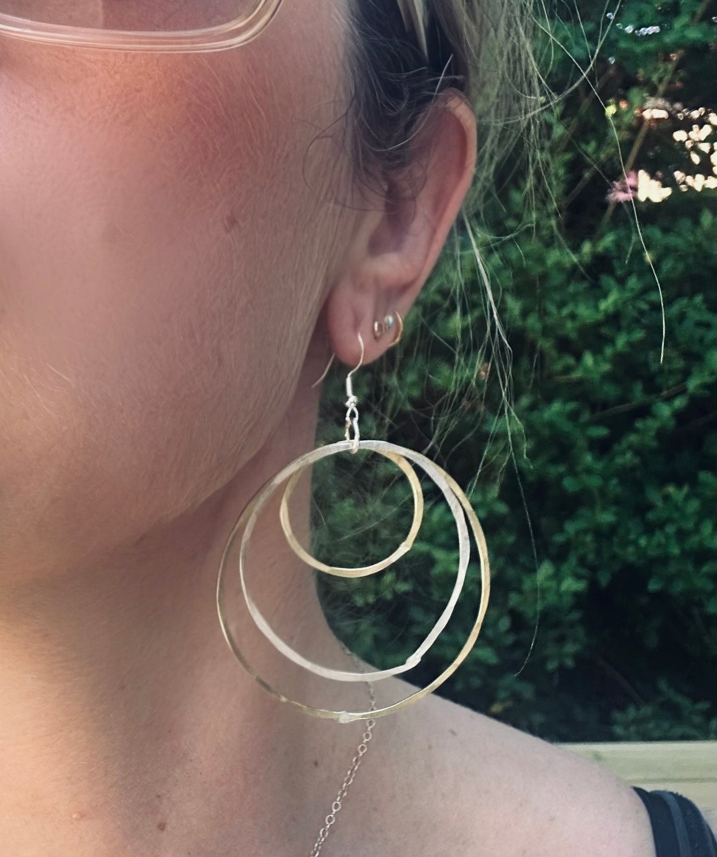 Large silver and brass tapered multi hoop earrings
