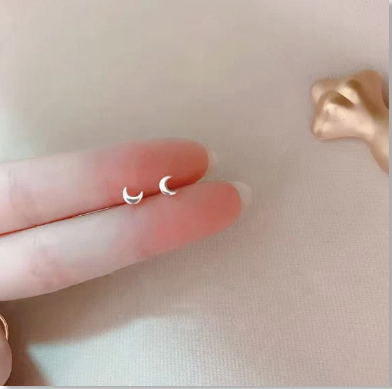 tiny silver crescent moon stud earrings