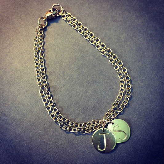gold double chain and initial disc bracelet