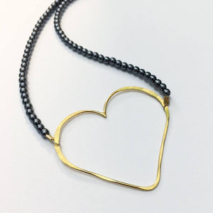 gold heart hoop and peacock pearl necklace