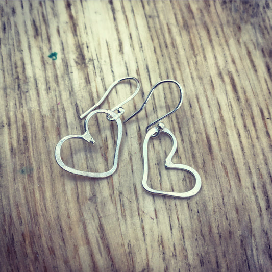 Hammered silver heart outline drop earrings