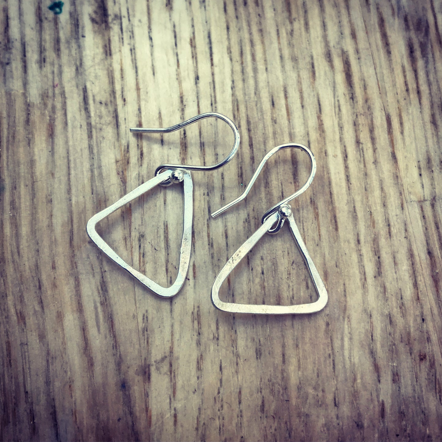 Hammered silver triangle outline drop earrings