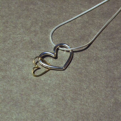 gold and silver heart hoop pendant