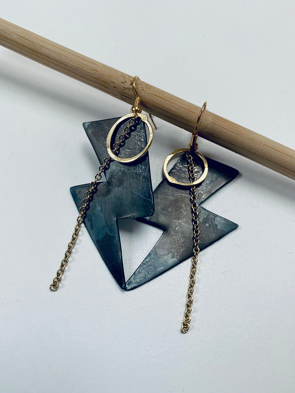 Oxidised silver large lightning bolt earrings with gold plated detail