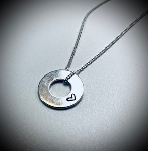 Flat silver hoop pendant with heart detail