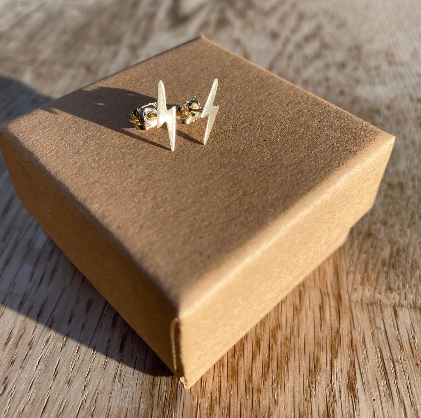 Gold lightning bolt stud earrings